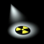 An image highlighting a nuclear symbol to illustrate the concept of radiation exposure.