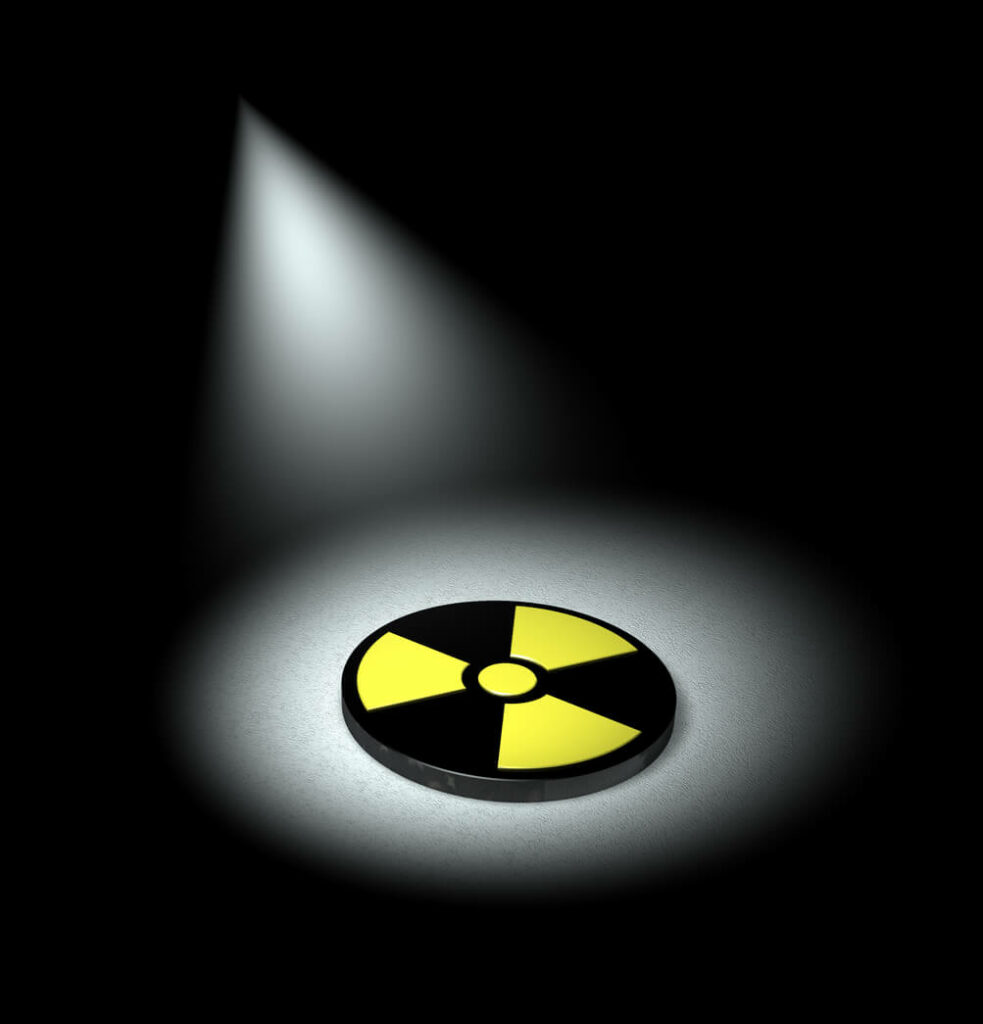 An image highlighting a nuclear symbol to illustrate the concept of radiation exposure.