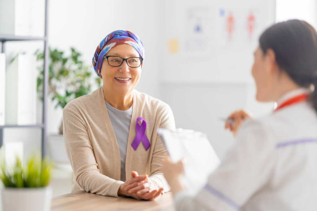 Image of a female cancer patient receiving medical support on World Cancer Day.