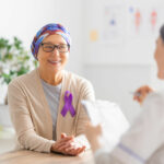 Image of a female cancer patient receiving medical support on World Cancer Day.