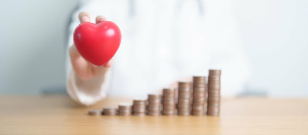Image of well-arranged coins and money stack illustrating funds for cancer expenses.