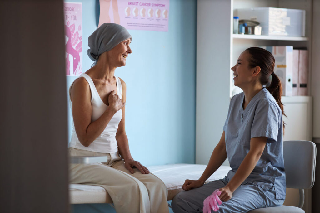 Middle Aged Woman with Cancer Consulting Female Medical Professional.